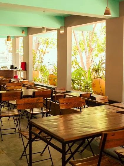 We ensure our dining areas are bright and open, with plenty of natural light and views of the lush greenery outside.