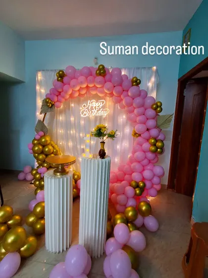 Another view of the pink and gold home birthday decor, showing the arrangement from a different angle.