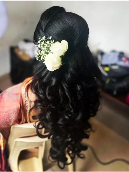 For receptions and modern events, a stylish high ponytail with soft waves is a great choice. It's chic, comfortable, and keeps the hair off your face while you celebrate.