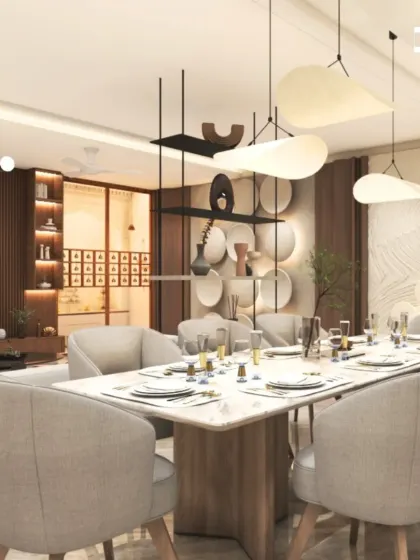 An elegant dining setup featuring a marble-topped table and upholstered chairs, set against a backdrop of rich wood paneling and sculptural wall decor.