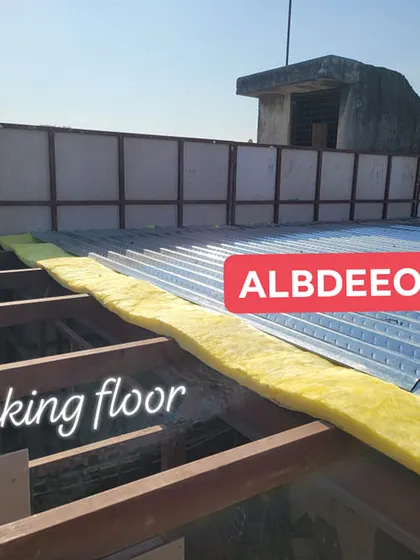 A close-up of our decking floor system, showing the metal sheet and glass wool insulation. This method is lightweight and perfect for rooftop constructions.