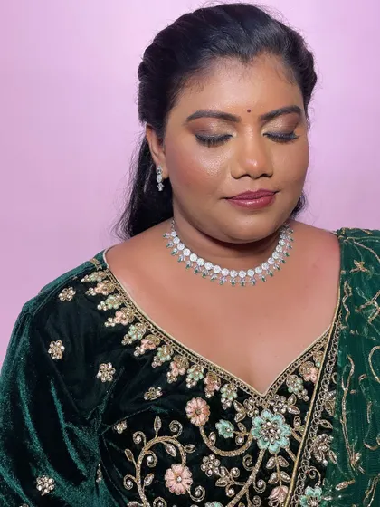 A close-up of Geetha's makeup, showing the blended smokey eye and a neutral lip. This is a classic combination that works beautifully for evening events.