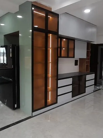 An expansive view of a newly completed open-plan interior. This shot captures the kitchen, dining, and living areas, showcasing our ability to execute large-scale, cohesive designs.