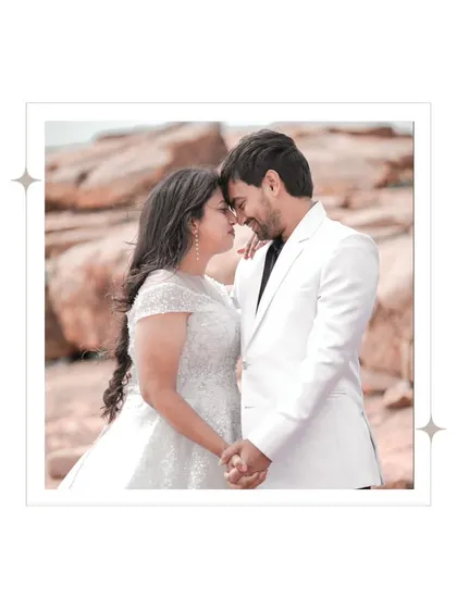 A close-up shot focusing on the couple's intimate connection, set against the warm, earthy tones of the Gandikota rocks.