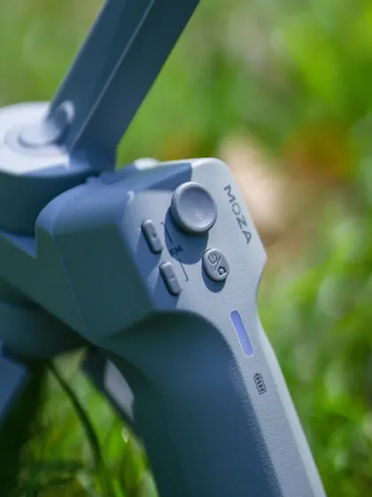 A close-up on the controls of the MOZA gimbal. This detail shot emphasizes the professional features of the equipment I use to control and perfect my video content.