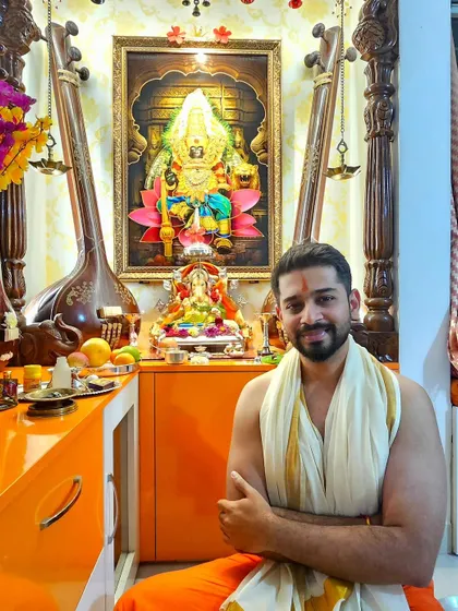 Dressed in traditional attire for Ganpati pooja. This image shows a deep-rooted connection to culture, which can be very appealing for brands targeting festive seasons.