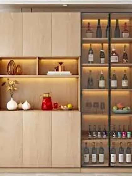 A modern bar and crockery cabinet with a mix of closed storage, open-lit shelves, and a dedicated wine rack. The light wood finish gives it a fresh and contemporary feel.