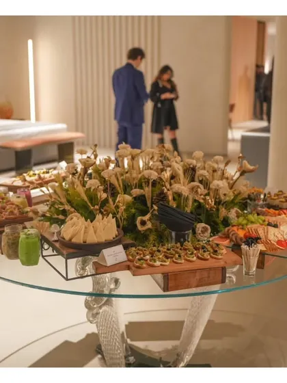 A wide view of a circular grazing table setup for a store launch, elegantly integrated into the event's decor.