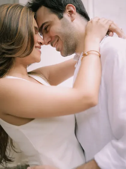 A happy, intimate moment between a couple, captured in a bright and airy style during a city pre-wedding shoot.