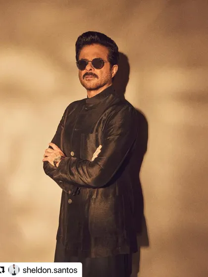 A portrait of Anil Kapoor where his classic hairstyle is the star.