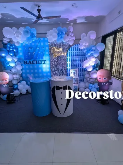 A wide-angle view of the Boss Baby birthday decor, showing how the entire setup fits perfectly within a home living room space, transforming it for the celebration.