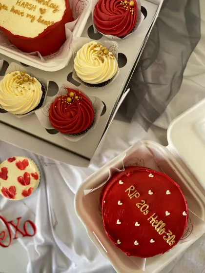 A collection of red-themed bento cakes and cupcakes. One bento has a fun "RIP 20s Hello 30s" message, perfect for a milestone birthday.
