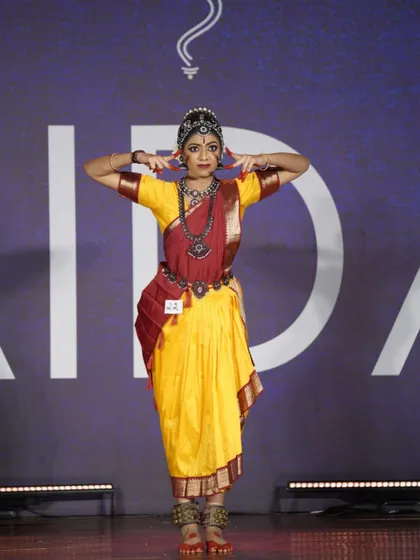 A student from our open category holding a powerful pose. Her strong performance was recognized with a 1st place award.