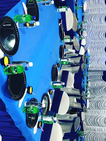 A clean and simple table setup with a blue and white theme. We can customize the decor and color palette to match the specific requirements of your event.