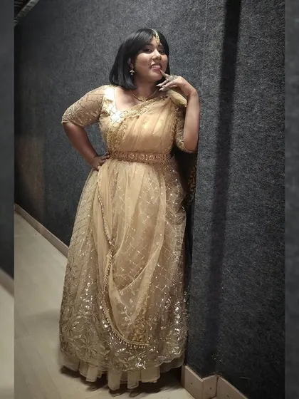 Posing in a lovely golden lehenga for a show. I work with talented designers to create unique looks for my television appearances.