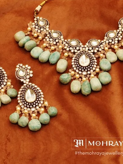A lovely pastel green beaded necklace set with uncut Polki stones. This is a great option for a daytime wedding or a bride who loves subtle colors.