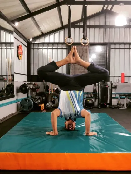 This headstand with legs in a diamond shape is another great pose for practicing balance and control. It also provides a good stretch for the hips.