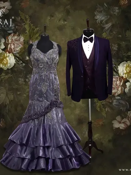 A harmonious pairing of purple hues. The groom's deep purple suit provides a rich foundation for the bride's lighter lavender gown, creating a visually stunning and coordinated look.