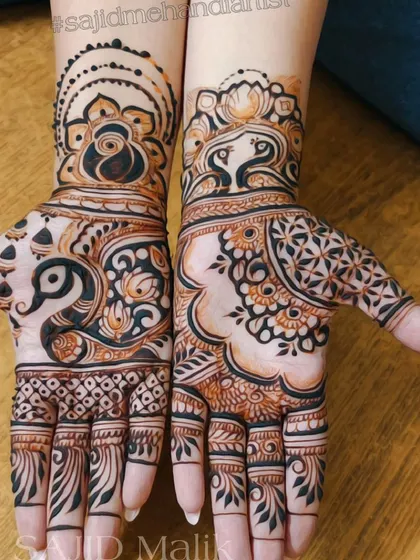 A bold and modern take on traditional motifs. This design uses negative space to highlight large peacock and floral elements, creating a striking and contemporary feel.