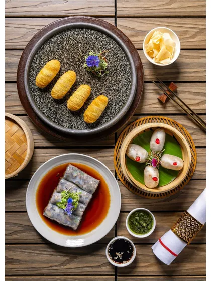 A collection of vegetarian dim sum, including Cheung Fun and fried rolls, arranged for the Shang Palace menu to showcase their diverse vegetarian offerings.