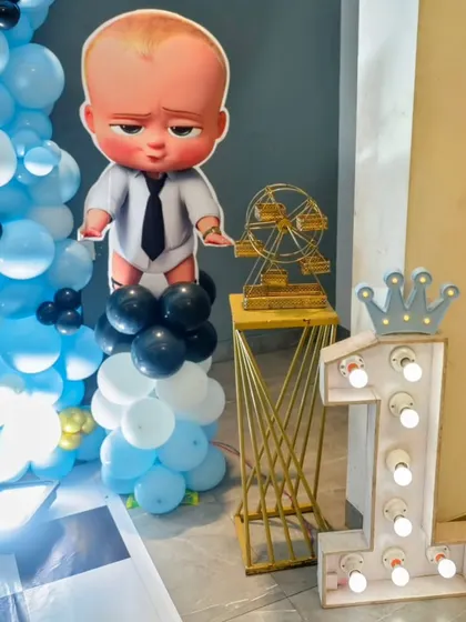 A close-up of the light-up number '1' and Boss Baby character prop.