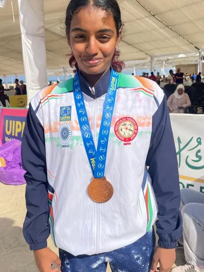 A close up of Nakshatra with her bronze medal from the Modern Pentathlon World Championship. Her success showcases the versatility of athletes training at our center.