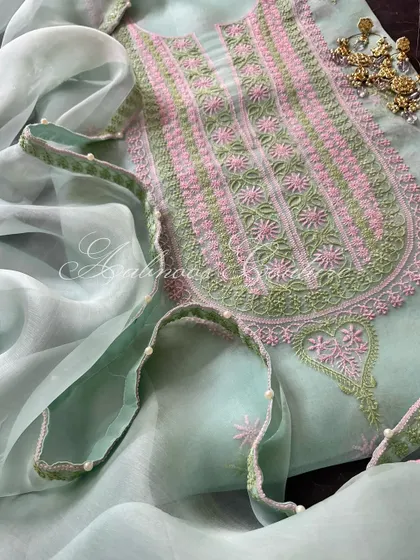 A close-up of the neckline and the pearl-adorned dupatta.