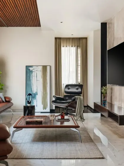 An informal living area in the Timber Edge project, characterized by a slatted timber ceiling and a warm, inviting material palette.