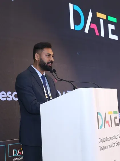 I switch gears from high-energy parties to formal corporate settings like the World Fintech Show. Dressed in a suit, I'm at the podium, ensuring the program runs smoothly for industry leaders and esteemed guests like Finance Minister Nirmala Sitharaman.