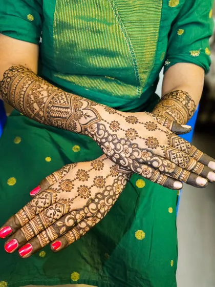 A crossed-hands pose to display the full design.