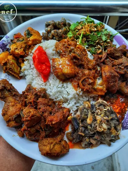 A holiday platter loaded with colorful and tasty dishes like pork with bamboo shoots, chicken stir-fry, duck curry, and 'singju'.