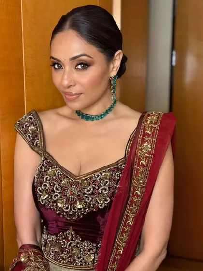 A final look at this sculpted and perfected party glam. The entire look, from the bold eyes to the contoured cheeks, comes together to create a truly memorable appearance.