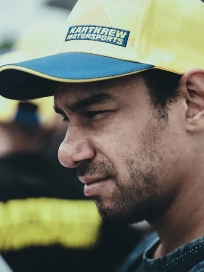 A portrait of one of our coaches, showing the focus and experience he brings to the team during a hectic race weekend.