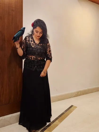 A different pose in the same lace outfit, showing a moment of quiet reflection. Your style should make you feel comfortable and poised in any situation.