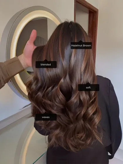 This hazelnut brown look showcases a soft, blended colour with beautiful waves. This is the kind of commercial, in-demand style we train our students to perfect.