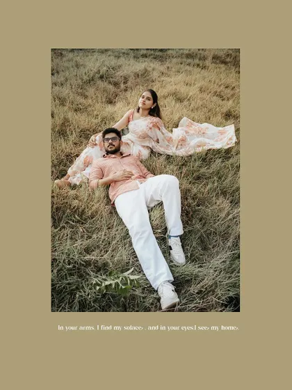 A serene pre-wedding portrait of a couple relaxing in a field.