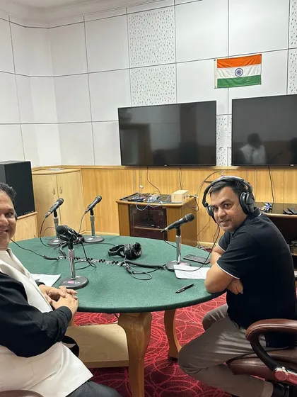 A candid moment in the All India Radio studio. The setup with headphones and microphones allows us to connect clearly with listeners who call in with their legal problems, making for an engaging and helpful program.