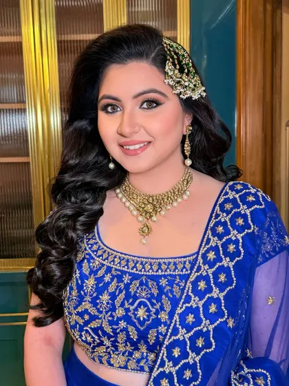 Sufi night enchantment. Arushi shines bright with gold shimmery eyes, a pretty pink pout, and a pop of bold blue kohl for a stunning and unique engagement look.