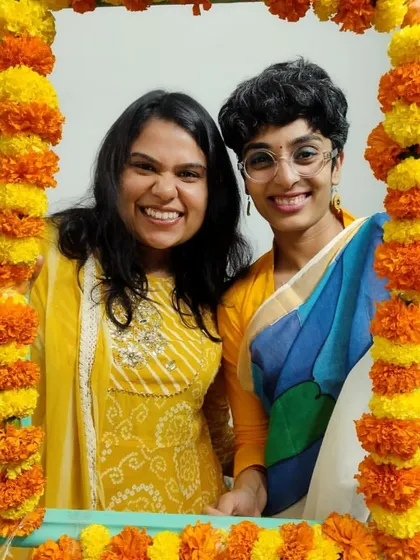 A happy moment from our Diwali party. We created a DIY photo frame with marigolds to capture the joy of the occasion. It's these small, creative touches that make my events special.