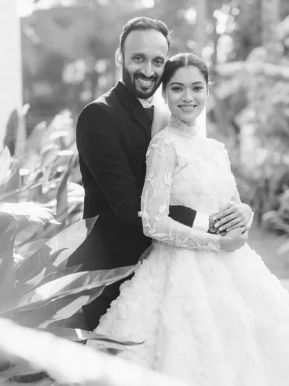 A classic and happy portrait of the couple in black and white. Their smiles and embrace capture the simple joy of being together on their wedding day.