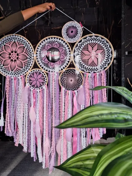A full view of the personalized pink cluster dreamcatcher, showing how the different-sized hoops and intricate patterns come together to form a cohesive, heart-shaped design.