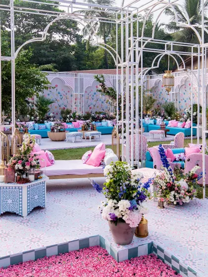 The surreal interconnected spaces of 'Botanical Marrakesh', where we built a glasshouse from scratch. A central water body filled with petals was surrounded by cozy lounges, creating a serene paradise.