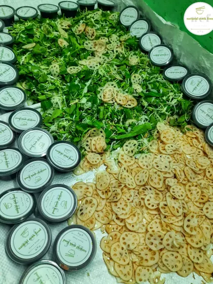 Getting the ingredients ready for my top-selling Manipuri 'Singju'. You can see the fresh greens, sliced lotus stem, and portioned spice mixes.
