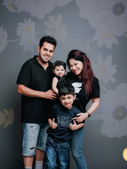 A fun and relaxed portrait of a family of four. We encourage families to be themselves, resulting in genuine smiles and a photo that truly represents their dynamic.