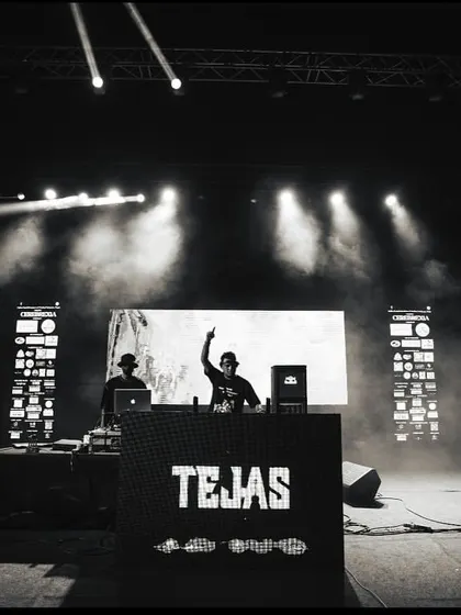 A black and white shot from the DJ booth at IGIMS Patna, capturing the stage and lighting setup.
