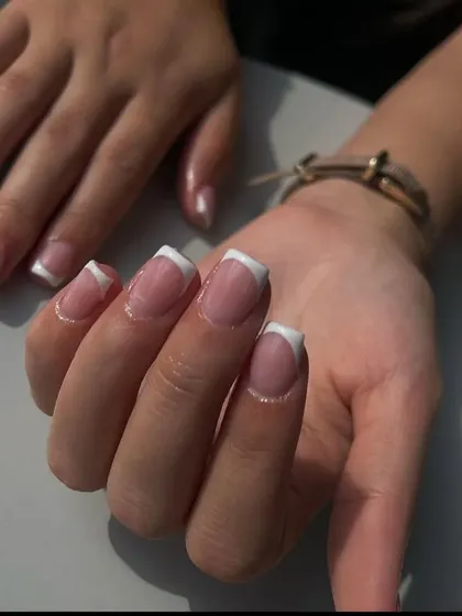A classic French manicure on medium-length square nails, a versatile and popular choice for any occasion.