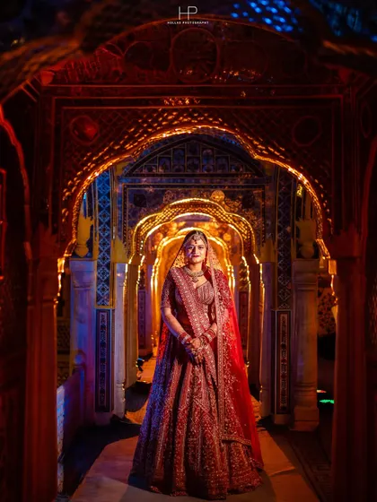 A bridal portrait should be as grand as the day itself. Here, I used the stunning architecture and dramatic lighting of the palace to frame the bride, making her look absolutely regal in her traditional red lehenga.
