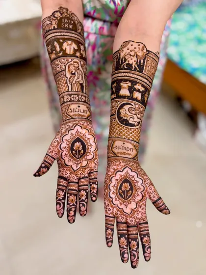 A personalized baby shower mehendi featuring portraits, names written in Tamil script ("Amma" and "Appa"), and symbolic elements like a mother cow with her calf.