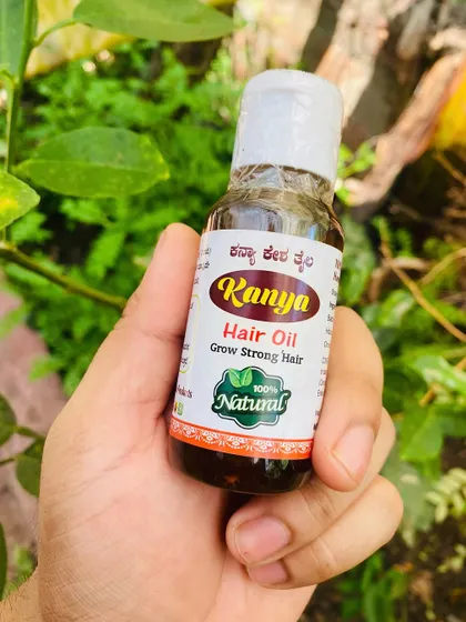 A single bottle of Kanya Hair Oil, showcasing its simple and honest packaging. What's inside is what truly matters.