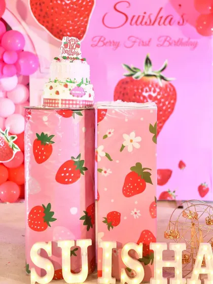 A strawberry-themed cake for a "Berry First Birthday." I can help coordinate the cake with your chosen theme to ensure every detail is perfect.